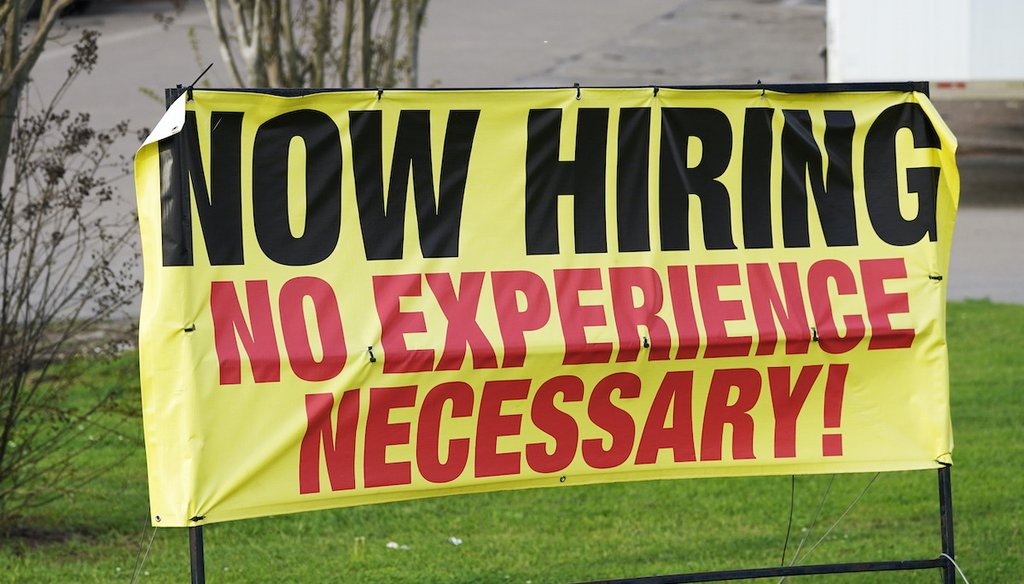 A roadside banner beckons potential employees outside Channel Control Merchants LLC, an extreme value retailer and exporter of brand sensitive secondary market inventories, in Hattiesburg, Miss., March 27, 2021. (AP)