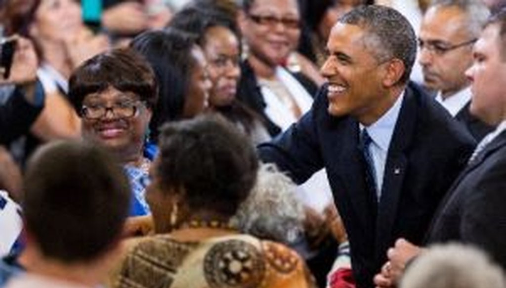 President Barack Obama greets attendees of his address on the economy at Knox College in Galesburg, Ill.