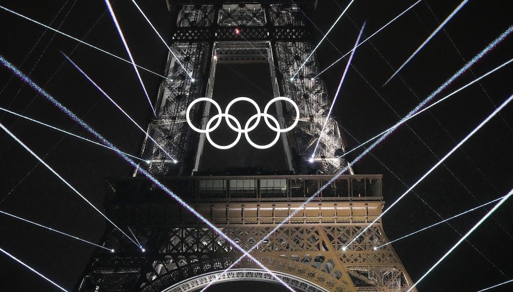 A light show is projected from the Eiffel Tower in Paris, France, during the opening ceremony of the 2024 Summer Olympics, July 26, 2024. (AP)