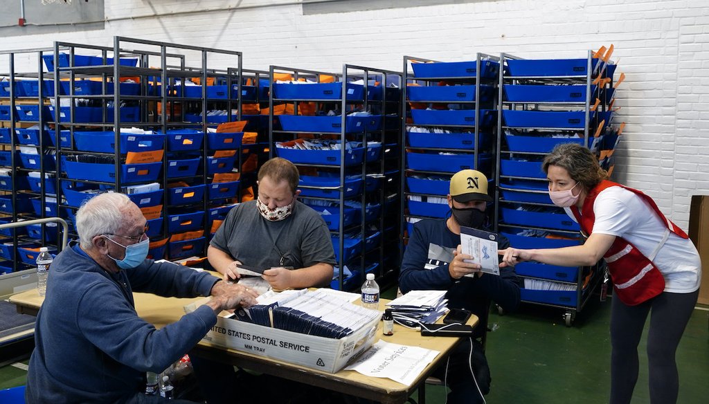 Chester County, Pa. election workers process mail-in and absentee ballots for the 2020 general election in the United States at West Chester University, Wednesday, Nov. 4, 2020, in West Chester, Pa. (AP)