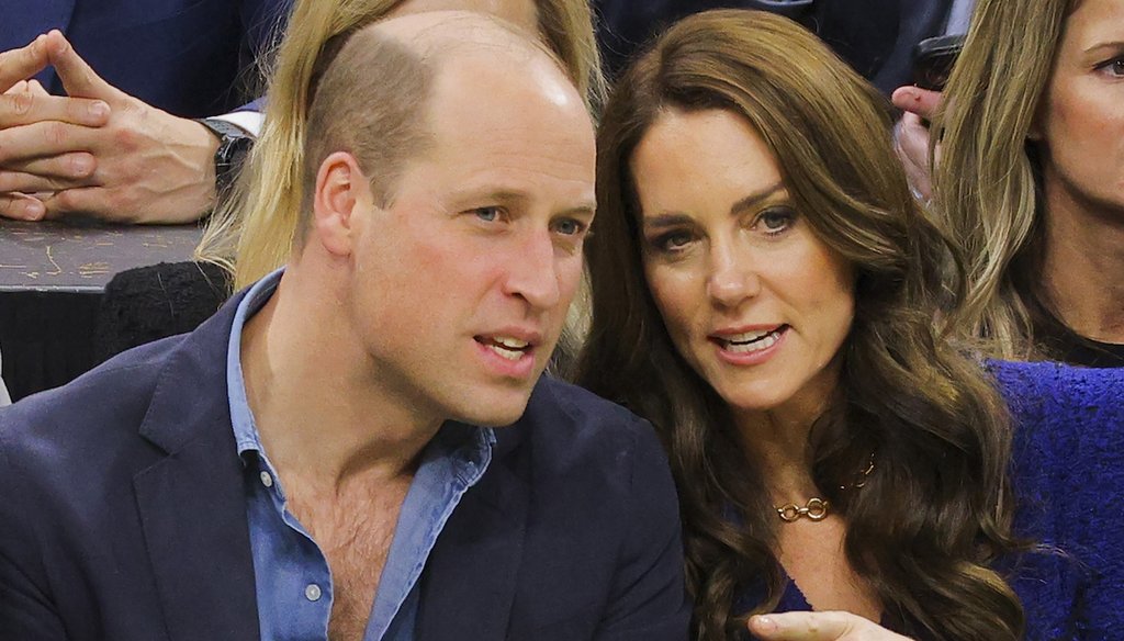 Britain's Prince William talks to Kate, Princess of Wales, in Boston, on Nov. 30, 2022.