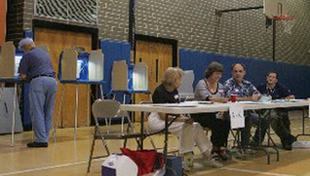 Poll workers in Cranston await voters during slow primary day in September 2008.