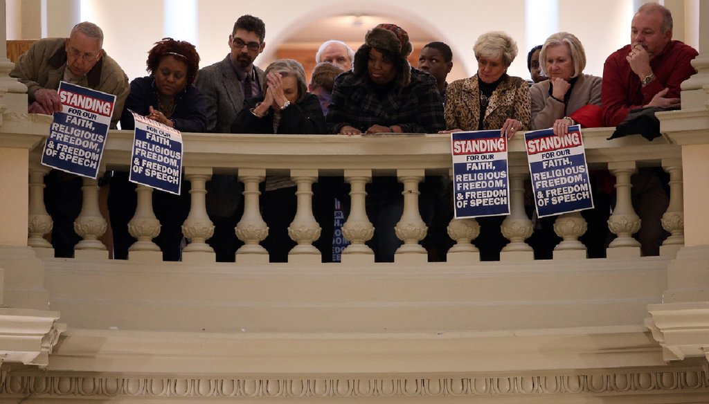 A crowd lines the railings above the Capitol Rotunda during a rally for former Atlanta Fire Chief Kelvin Cochran, whose firing has energized supporters of a proposed religious liberty bill. Photo by Ben Gray / AJC.COM