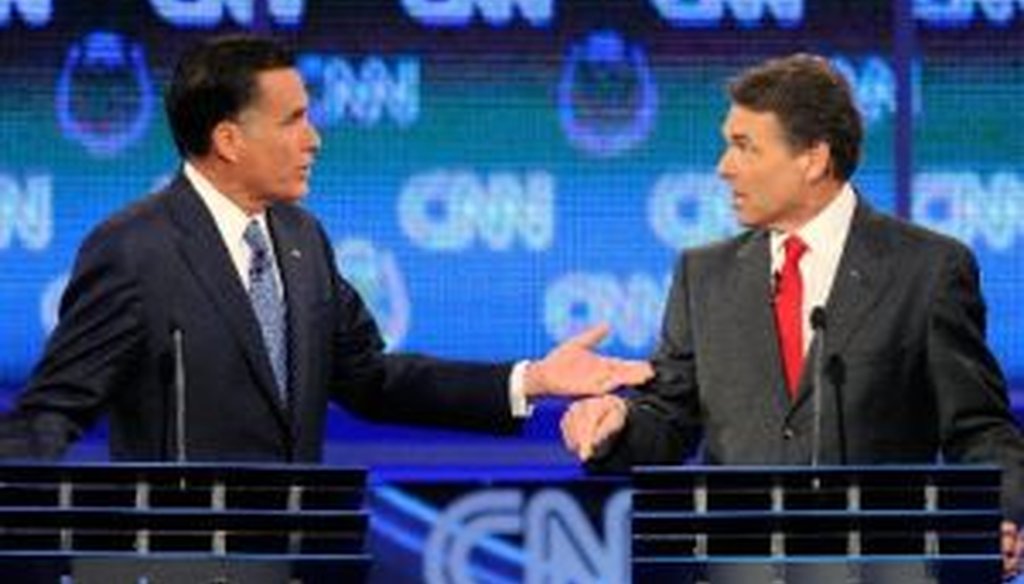 Former Massachusetts Gov. Mitt Romney and Texas Gov. Rick Perry gesticulate during the Oct. 18, 2011, Republican presidential debate in Las Vegas.