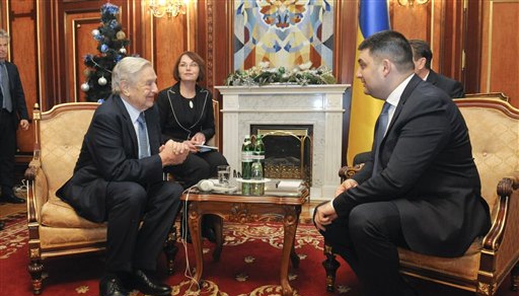 George Soros, left, chairman of Soros Fund Management and founder of The Open Society Institute, speaks with Volodymyr Groysman, Ukrainian parliament speaker in Kiev, Ukraine, Monday, Jan. 12, 2015. (AP)