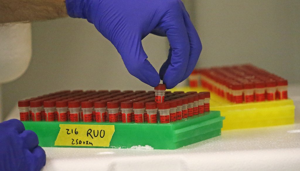 A lab technician prepares components for COVID-19 testing kits in Salt Lake City. (AP Photo/Rick Bowmer)