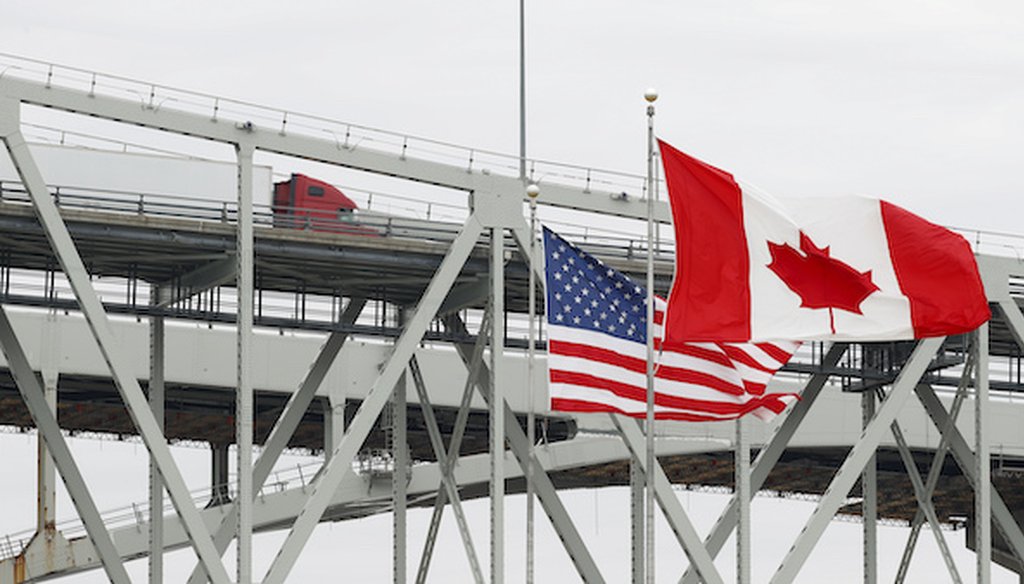 A truck crosses the Blue Water Bridge into Port Huron, Mich., from Sarnia, Ontario, Canada, on March 18, 2020. (AP)