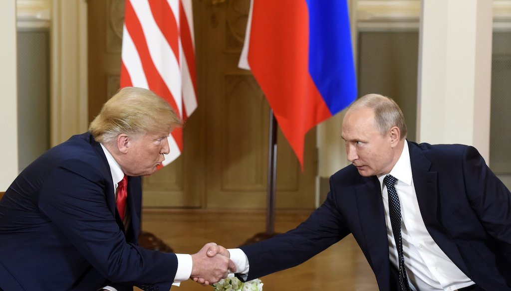 U.S. President Donald Trump and Russian President Vladimir Putin shake hands during their meeting in the Presidential Palace in Helsinki on July 16, 2018. (AP)