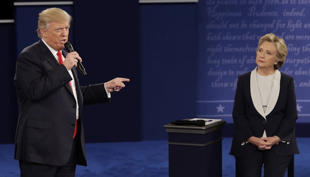 Republican presidential nominee Donald Trump speaks to Democratic presidential nominee Hillary Clinton during the second presidential debate at Washington University in St. Louis, Sunday, Oct. 9, 2016. (AP Photo/John Locher)