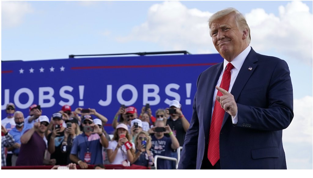 President Donald Trump arrives to speak at a campaign rally in Oshkosh, Wis. (AP Photo/Evan Vucci)