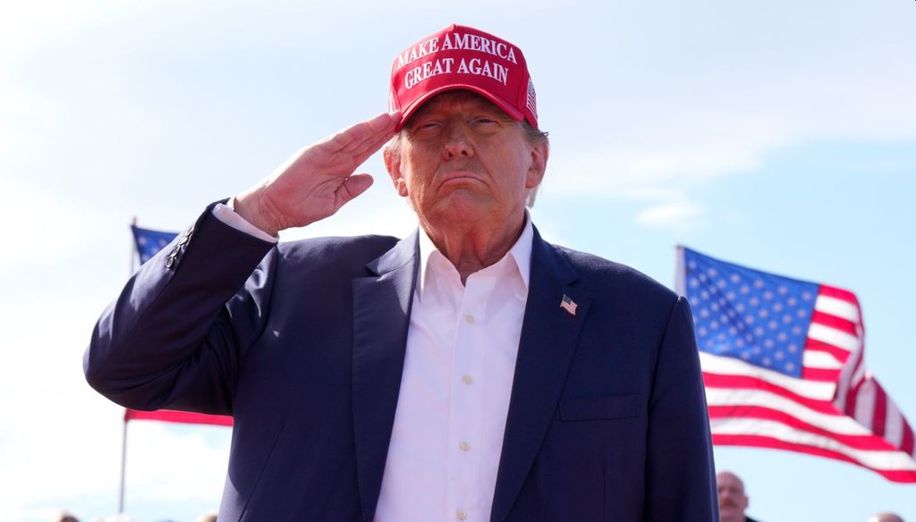 Former President Donald Trump salutes at a campaign rally on March 16, 2024, in Vandalia, Ohio. (AP)