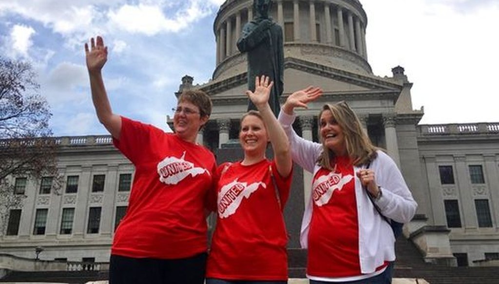 Striking teachers Michelle Myers, left, Holly O’Neil, center, and Suzanne Varner of McNinch Primary School in Moundville, W.Va., outside the state capitol in Charleston, W.Va, on Feb. 23, 2018. (AP/John Raby)
