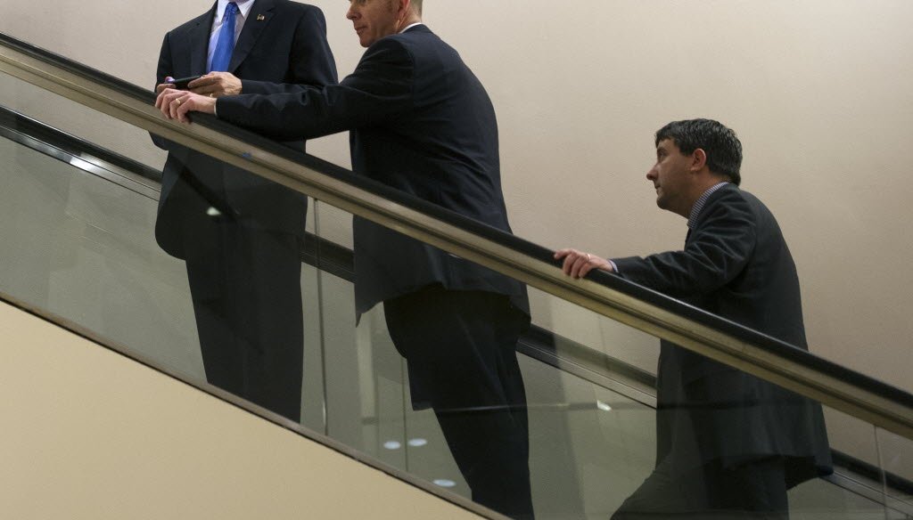 Wisconsin Gov. Scott Walker, left, leaves a meeting during the National Governors Association winter meeting in Washington, D.C., on Feb. 22, 2014