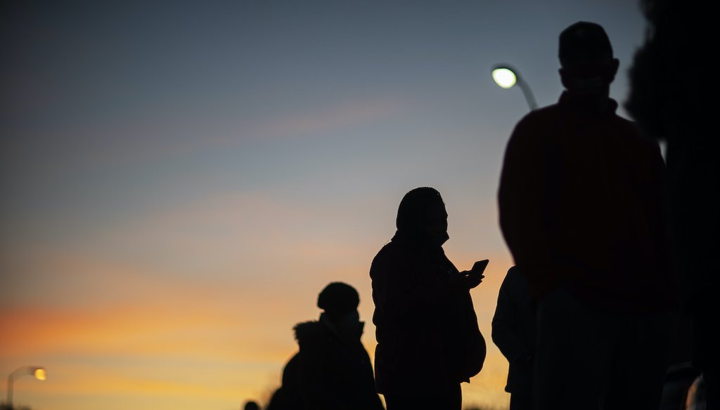 Voters line up before polls open on Election Day at a precinct in Warren, Mich., Tuesday, Nov. 3, 2020. (AP)