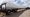 In this 2009 photo, a Vestas wind turbine blade sits on the back of a flatbed trailer near Brighton, Colo. (AP)