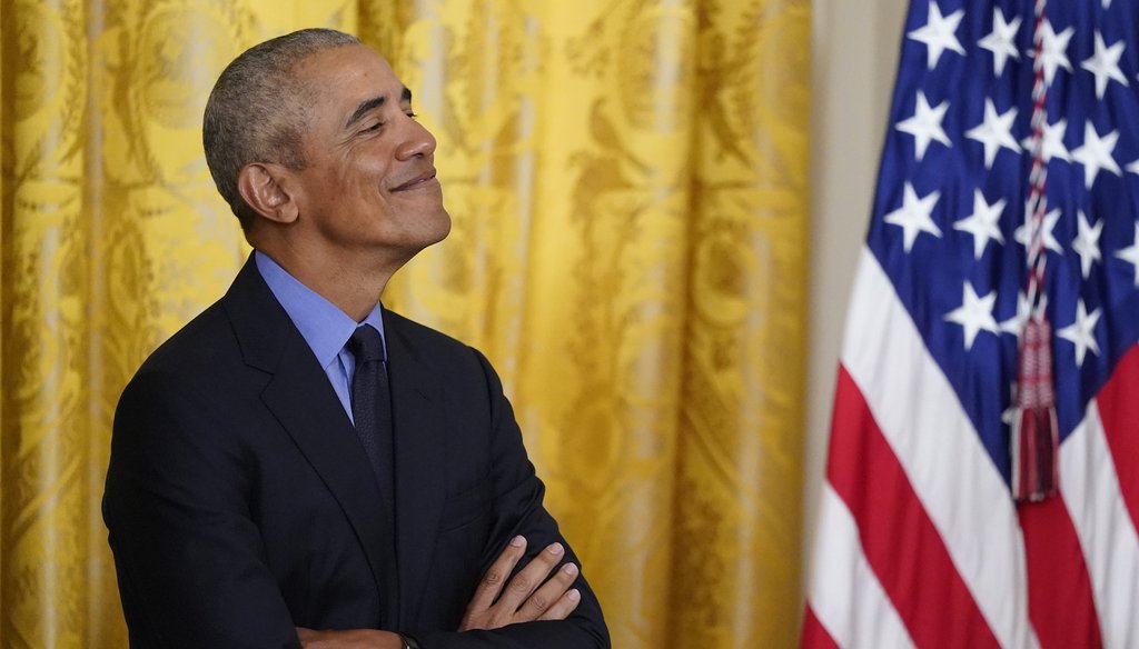 Former President Barack Obama looks on as President Joe Biden speaks duding an event about the Affordable Care Act at the White House on April 5, 2022. (AP Photo/Carolyn Kaster)