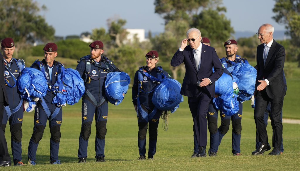 President Joe Biden arrives to greet Italian Army parachuters after watching a skydiving demonstration, at the G7 summit, June 13, 2024, in Fasano, Italy. (AP)