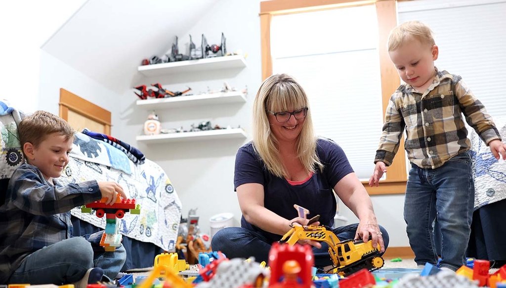 Karli Neilson plays with her sons Ezra, 5, left, and Axel, 2, on Sept. 2, 2022, in Gearhart, Ore. Neilson hasn't been able to find formal care for him since he was born in August 2020. (AP)