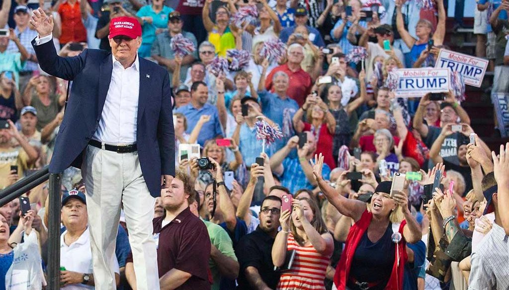 Republican presidential candidate Donald Trump waves to thousands of fans in Mobile, Ala., at an Aug. 22, 2015, campaign rally. Trump has said he would try to end birthright citizenship if elected. (AP photo)