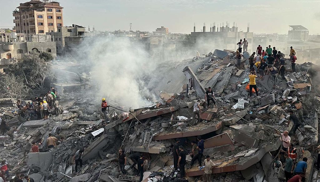 Palestinians displaced by the Israeli air and ground offensive on the Gaza Strip walk through a makeshift tent camp May 10, 2024 , in Rafah, Gaza. (AP)