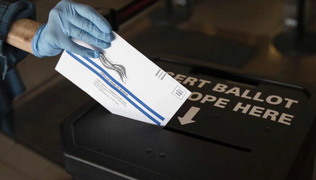 In this May 28, 2020, file photo a voter casts her mail-in ballot at in a drop box in West Chester, Pa., prior to the primary election. (AP)