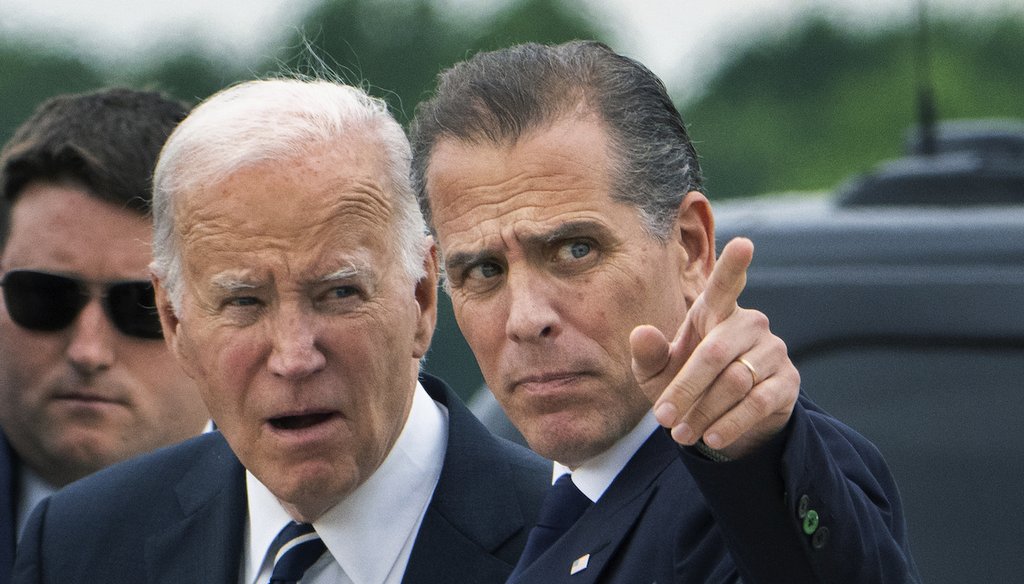 President Joe Biden talks with his son Hunter Biden as he arrives Delaware Air National Guard Base in New Castle, Del., June 11, 2024. (AP)