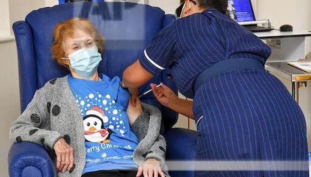 90 year old Margaret Keenan, the first patient in the UK to receive the Pfizer-BioNTech COVID-19 vaccine, administered by nurse May Parsons at University Hospital, Coventry, England, Tuesday Dec. 8, 2020. (AP)