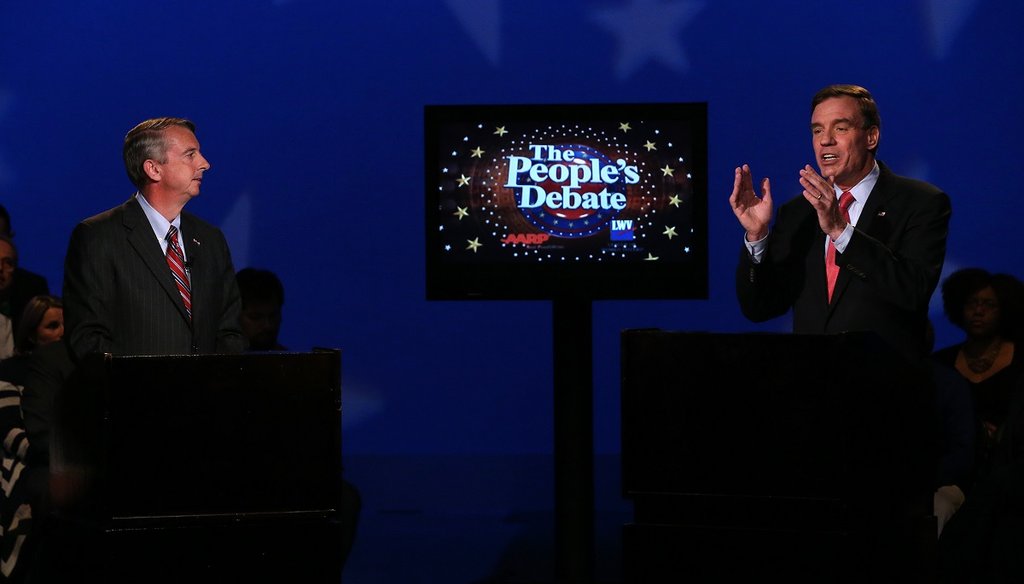 Sen. Mark Warner, D-Va., right, gestures as Republican challenger Ed Gillespie listens during Monday night's People's Debate at WCVE studios in Chesterfield County.