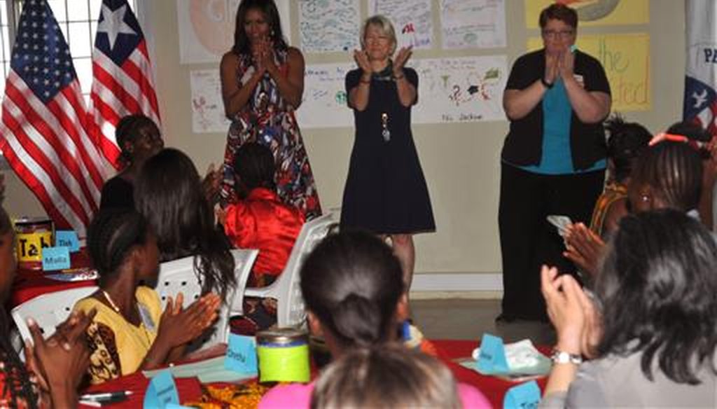 U.S. first lady Michelle Obama speaks with Peace Corps. volunteers and students outside of the Liberian capital of Monrovia on June 27, 2016