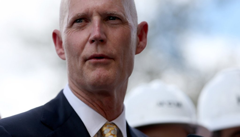 Gov. Rick Scott, shown here in Hialeah in March, has been saying the federal government can't be trusted to follow through on its promises because they ended funding for an experimental Medicaid program. (Getty photo)