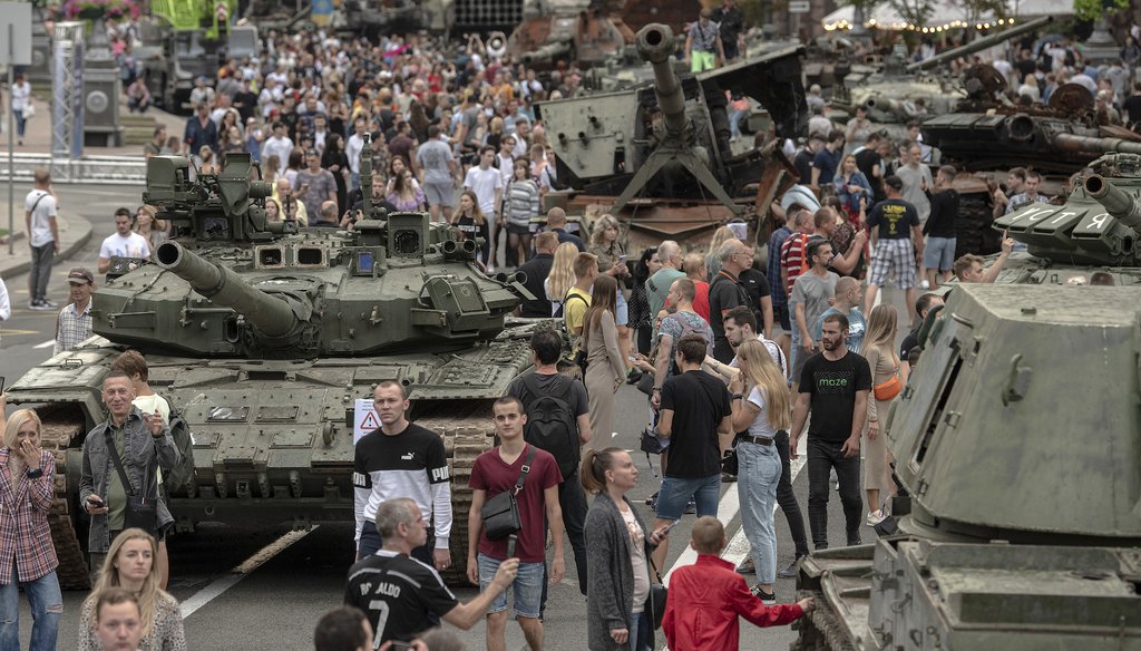 Ukrainians visit an avenue where destroyed Russian military vehicles have been displayed in Kyiv, Ukraine, on Aug. 20, 2022. (AP)