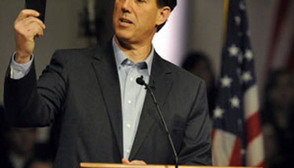 Rick Santorum holds up his pocket copy of the Constitution during a Rally for Rick at Temple Baptist Church in Powell, Tenn., Feb. 29, 2012. (MICHAEL PATRICK | Knoxville News Sentinel)