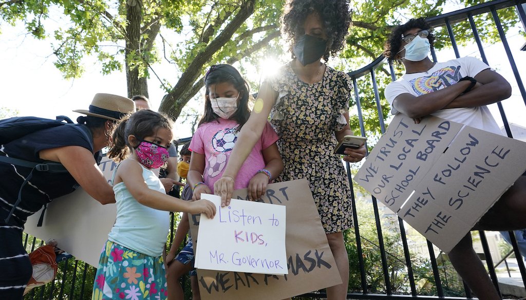 Students and parents gather outside the Governor's Mansion to urge Texas Gov. Greg Abbott to drop his opposition to public school mask mandates on Aug. 16, 2021. (AP)