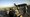 Troops walk toward a C-17 aircraft at Sather Air Base in Iraq. (2010 AP Photo)