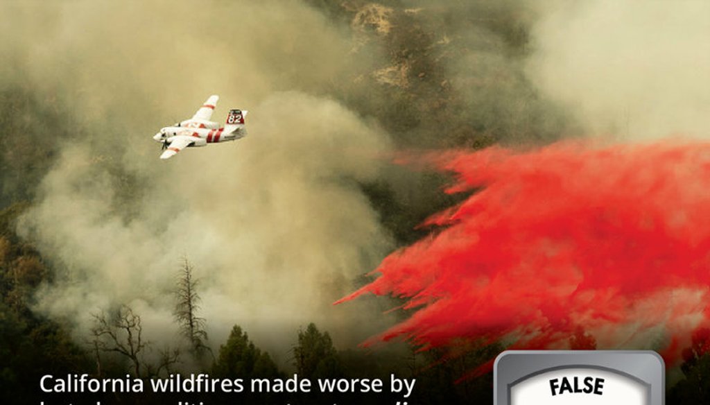 An air tanker drops retardant while fighting to stop the Ferguson Fire from reaching homes in the Darrah community of unincorporated Mariposa Count, Calif., Wednesday, July 25, 2018. Noah Berger / AP Photo