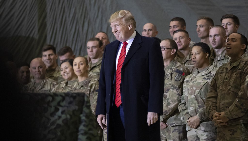 In this Nov. 28, 2019, file photo President Donald Trump smiles before addressing members of the military during a Thanksgiving Day visit at Bagram Air Field, Afghanistan. (AP)