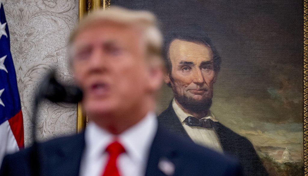 A painting of President Abraham Lincoln is seen behind President Donald Trump as he speaks Sept. 30, 2019, in the White House’s Oval Office. (AP)