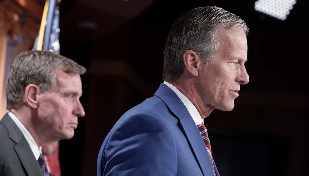 Sen. John Thune, R-S.D., right, with Sen. Mark Warner, D-Va., left, speaks March 7, 2023, during the news conference to introduce the RESTRICT Act on Capitol Hill in Washington. (AP)