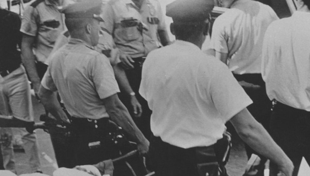 Charles Whitman's body being removed from the UT Tower after he was shot to death by police Aug. 1, 1966 (Texas Student Publications photo, Larry Mayo. Courtesy Barker Texas History Center).